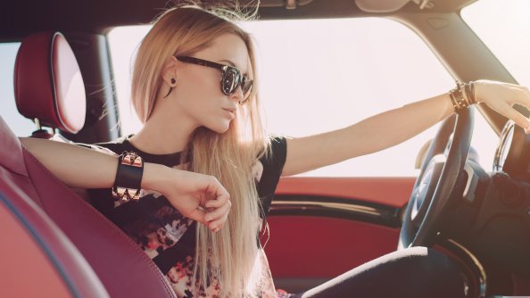 Blonde Girl Sitting In Car