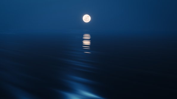 Moon Rising Over The Ocean At Night