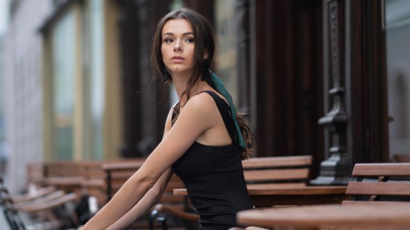Girl Outdoor Sitting On A Bench Looking Away 4k