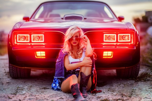 Model Sitting In Front Of The Car