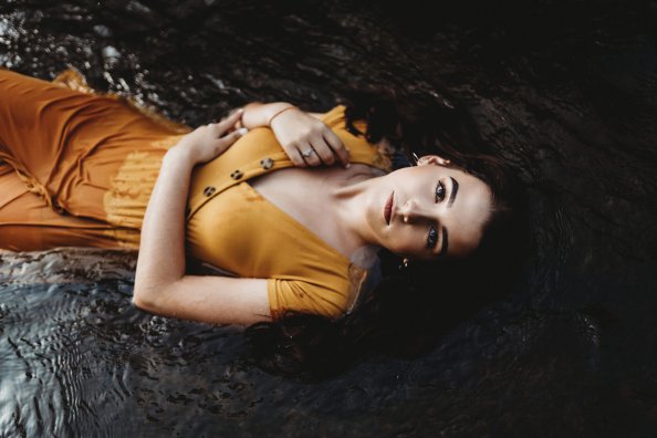 Girl Lying Down Orange Dress 4k