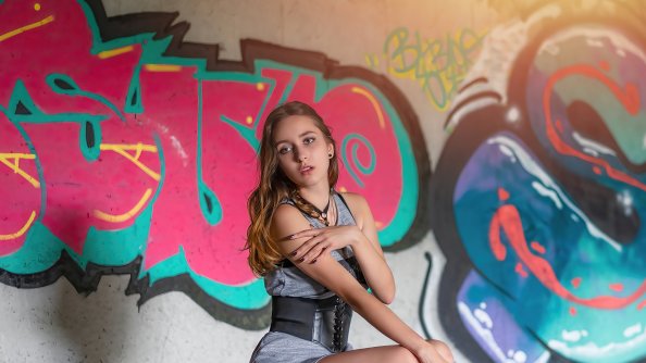 Girl Sitting Graffiti Wall 4k