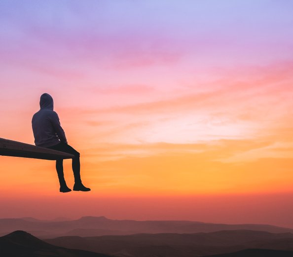 Man Watching Sunset On Top