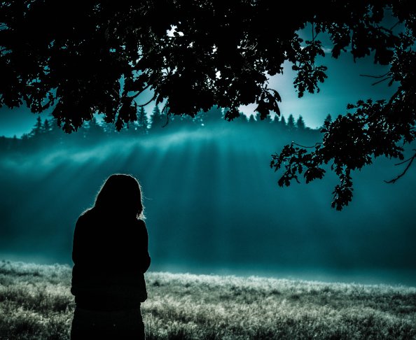 Girl Standing Under Tree