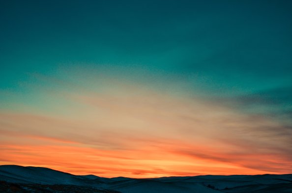 Sunset Over Mountains Covered By Snow 5k
