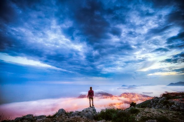 Girl On A Ledge Overlooking