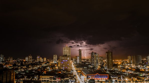 Thunderstorms Above City During Night Time