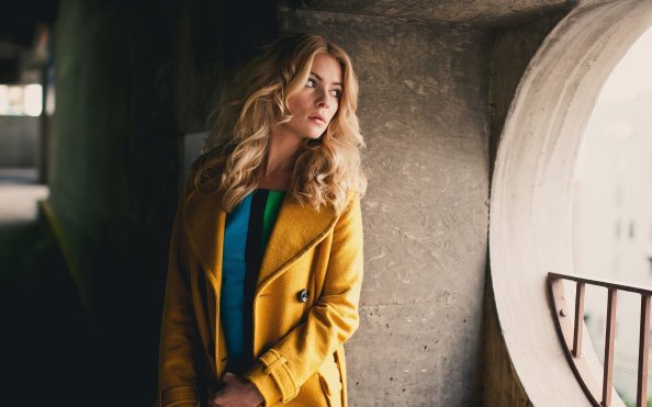 Girl Yellow Coat Looking Away