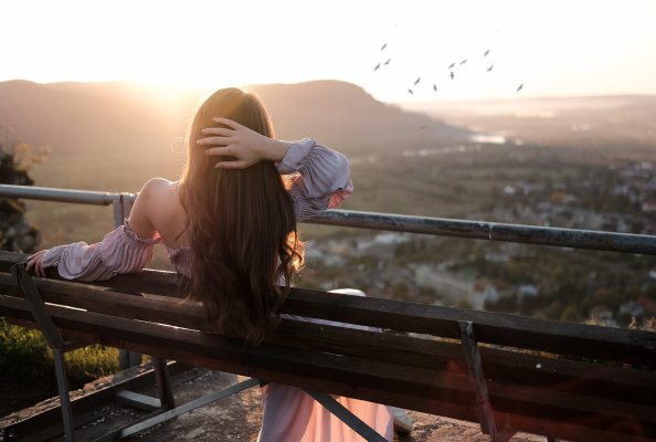 Girl Sitting Bench Back Hands In Hair Nature Outdoors
