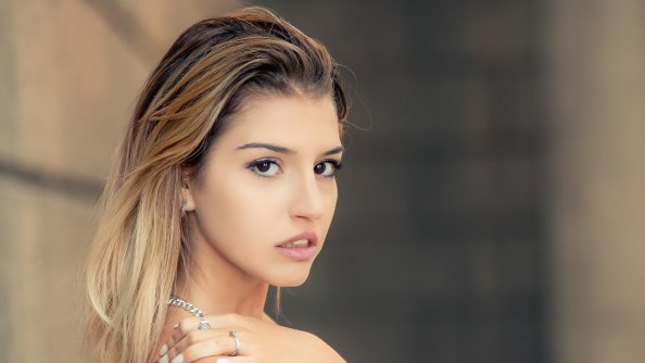 Girl In Beautiful Dress Looking Back At Viewer