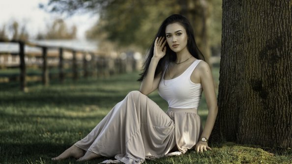 Girl Sitting Under Tree