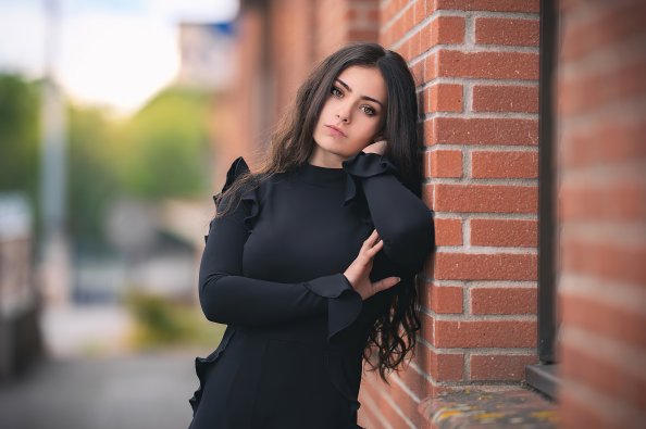 Hand On Face Brown Eyes Black Dress