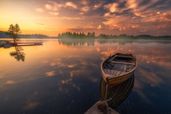 Boat In Silent Lake Nature Sunset