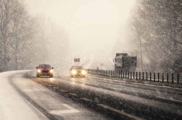 Snowstorm On Highway Vehicles