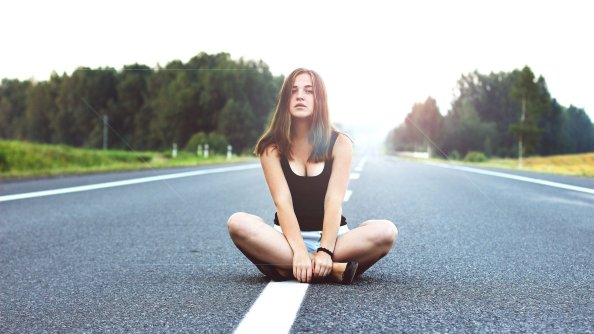 Girl Sitting On Road