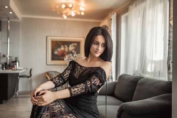 Women Sitting In Black Dress