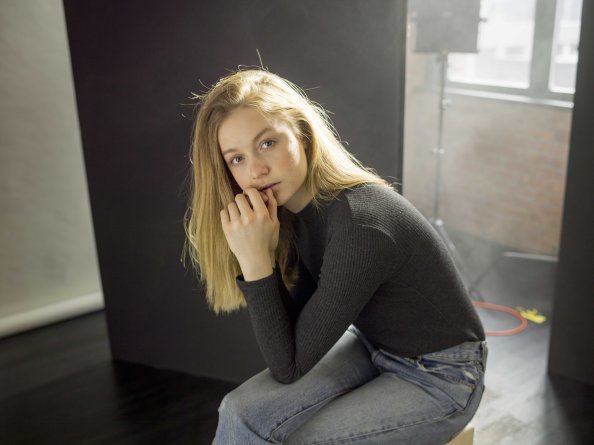 Beautiful Girl Sitting Looking At Viewer