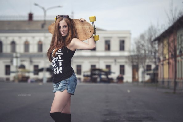 Brunette Girl With Skateboard
