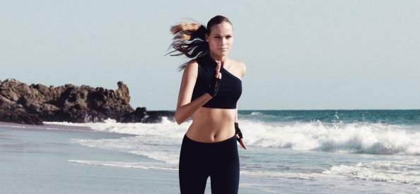 Sports Model Running On Beach