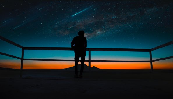 Person Silhouette Meteors Night Sky 8k