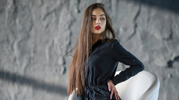 Girl Looking Away Sitting On Chair 4k