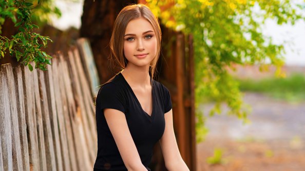 Cute Girl Black Clothing Sitting On Bench