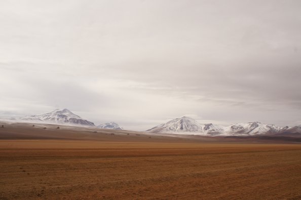 Snow On A Mountain Behind The Desert