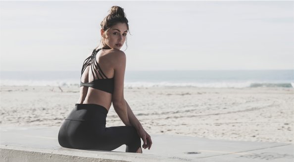 Model Sitting On Beach