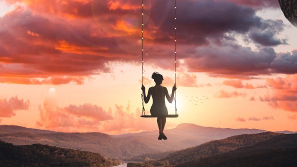 Girl Swinging On Top Of World