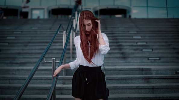 Redhead Girl Walking Down Stairs