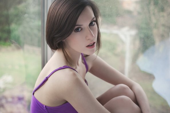 Women Holding Knees Indoors