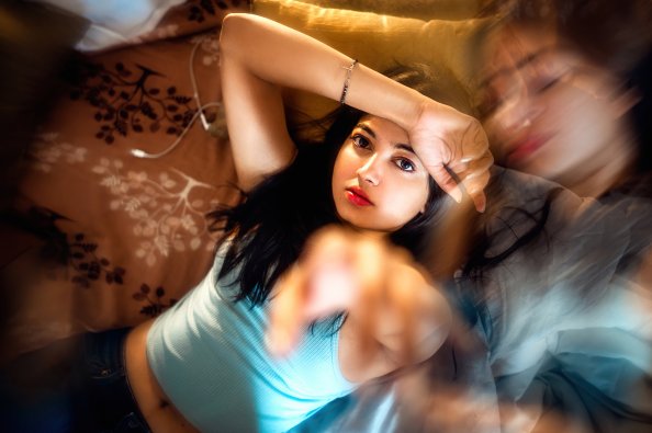 Cute Girl Looking At Viewer Arm On Forehead