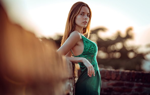 Beautiful Girl Green Dress Leaning On Wall