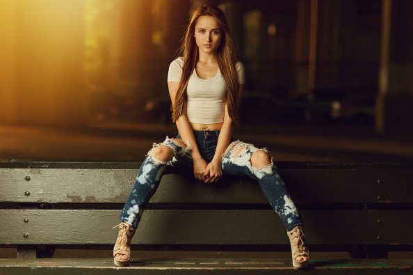 Blonde Girl Sitting On Bench