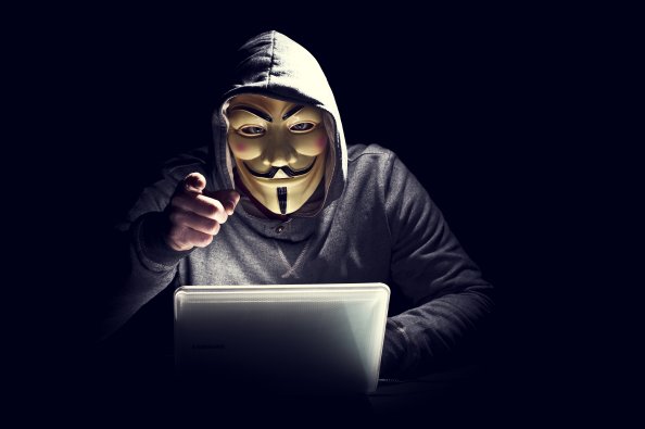 Anonymus Hacker In Mask Pointing Finger