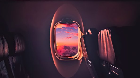 Beautiful Sunset Through Airplane Window