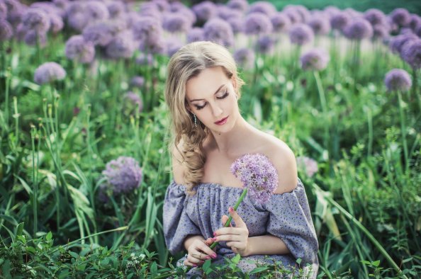 Beautiful Women With Flowers In Field