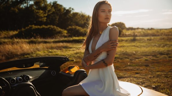 White Dress Girl Sitting On Convertible Car In Nature