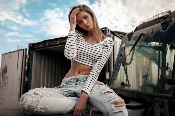 Pierced Navel Girl Sitting On Car Bonnet